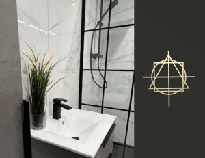 Sleek modern ensuite with black fixtures and a marble wall, showcased at our bathroom showroom. Features a stylish sink and shower.